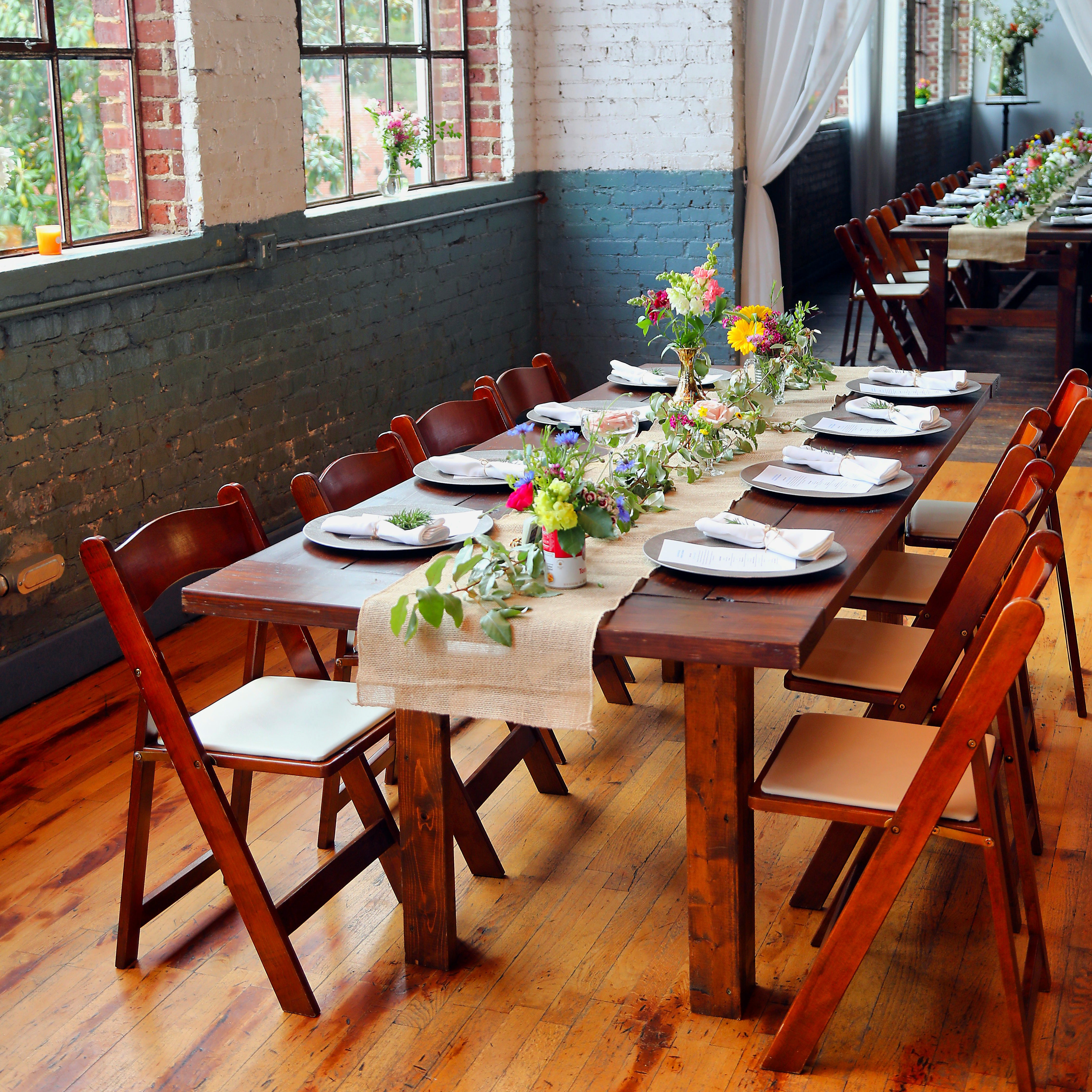 a table set for 6 with flower centerpieces